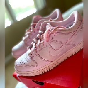Big Kids Pink dunks, gently used. The shoe string on one of the shoes is broke